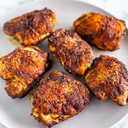 Crispy air fryer chicken thighs on a plate