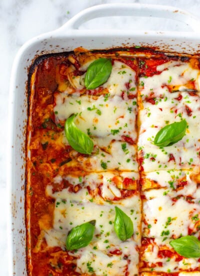 Close-up shot of cooked zucchini lasagna in a baking dish